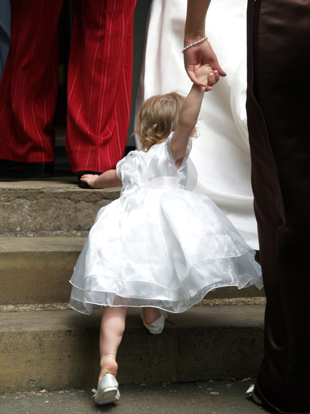 flower girl going up stairs
