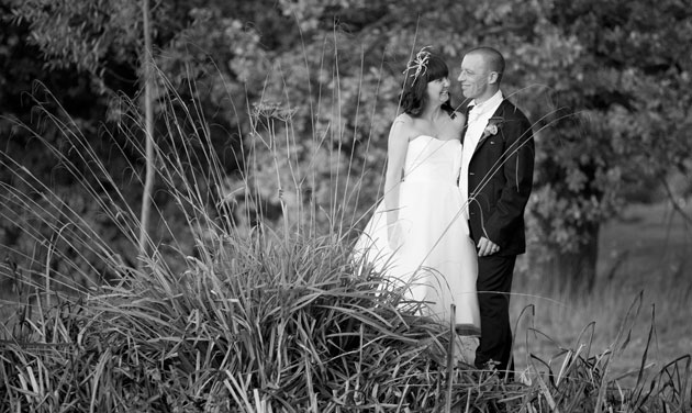 wedding couple photographed from across the pond at Colne Valley Essex