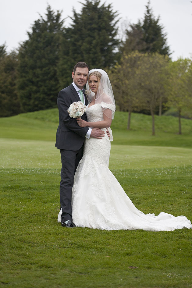 Bride and groom on golf course Essex
