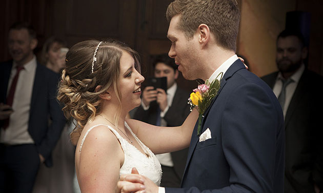 bride and groom facing each other at first dance at Hylands House