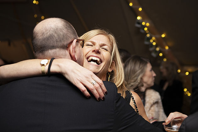 People hugging at a party