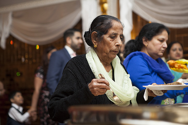 Woman at an Indian buffet table