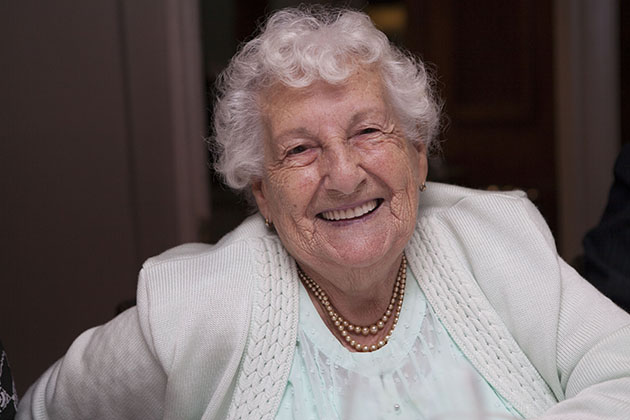 Informal portrait of a 90 year old woman looking at the camera