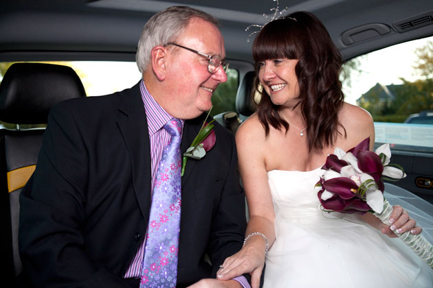 bride and father arriving in cab