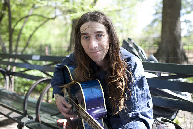 busker at Strawberry Fields