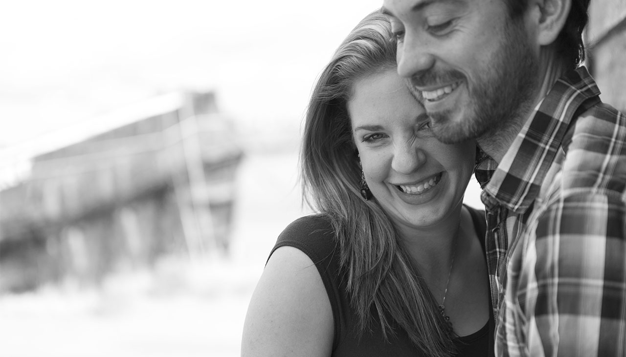 engaged couple holing each other and laughing during pre wed shoot in Maldon Essex