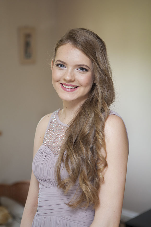 portrait of smiling bridesmaid looking at camera