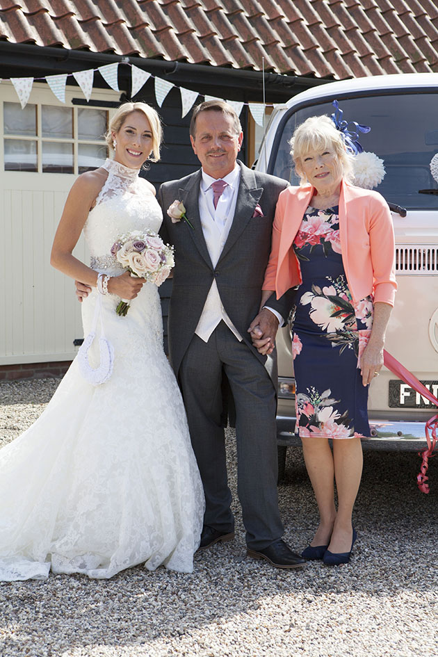 bride with mother and father standing in front of VW kombi van