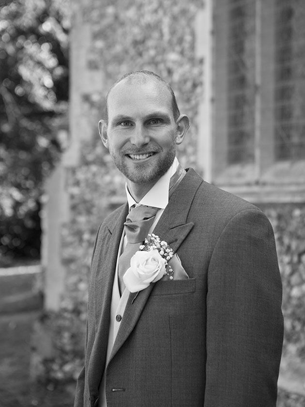 groom outside church before getting married