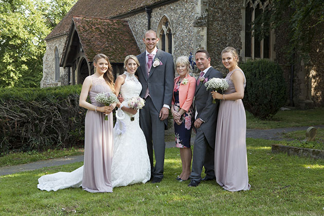 family wedding group photo in the grounds of an Essex church
