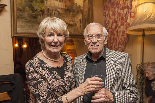 Couple at a family party looking at the camera