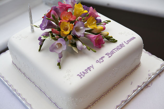 90th birthday cake decorated with flowers
