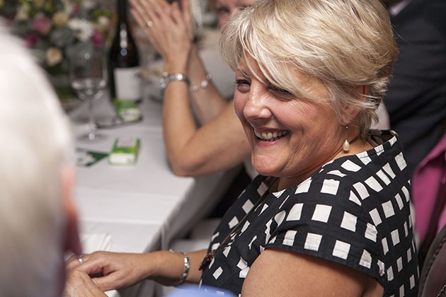 Woman at a restaurant table smiling