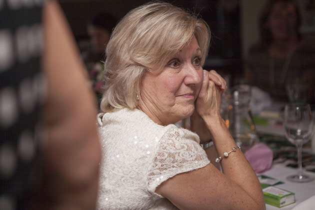 Woman at a restaurant table at a family celebration