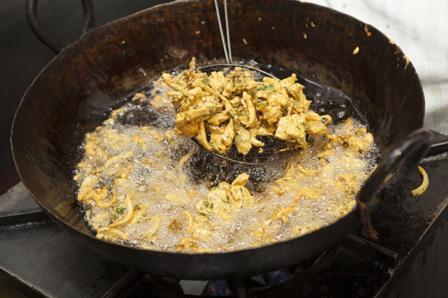 Deep fried pakora in a frying pan