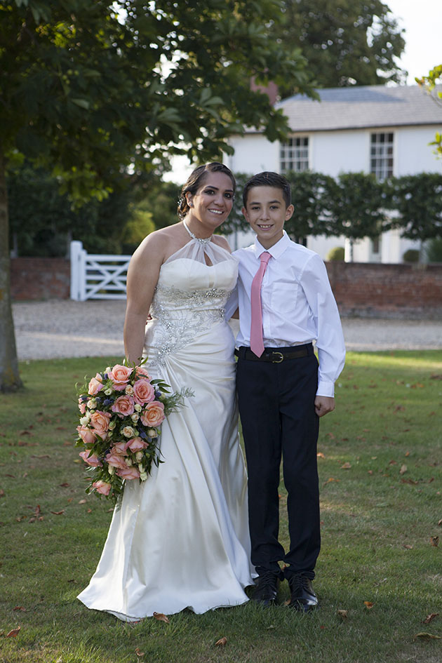 Full length portrait of bride with her young son at Vaulty Manor