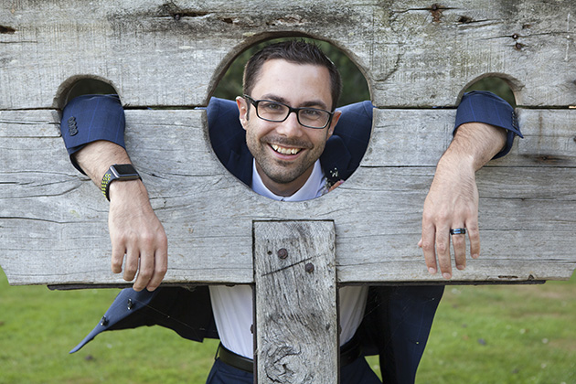 Groom with his head and hands in the stocks