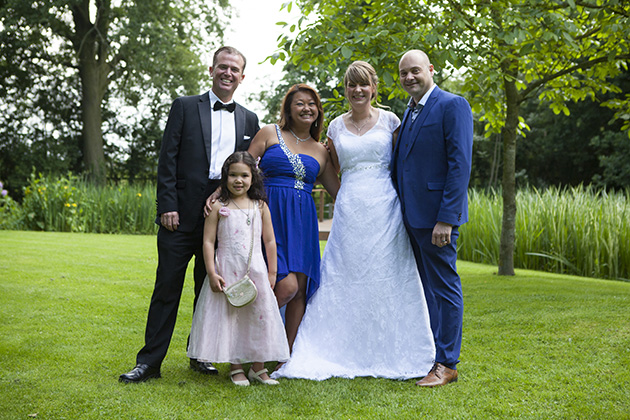 Group photo of bride and groom with friends