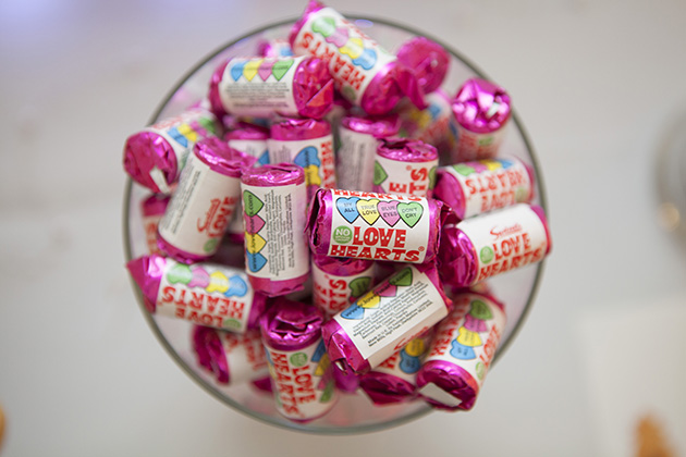 Bowl of love hearts sweets photographed from above