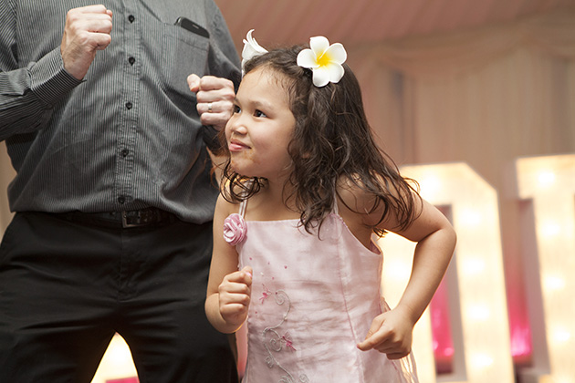 Young girl dancing at a wedding
