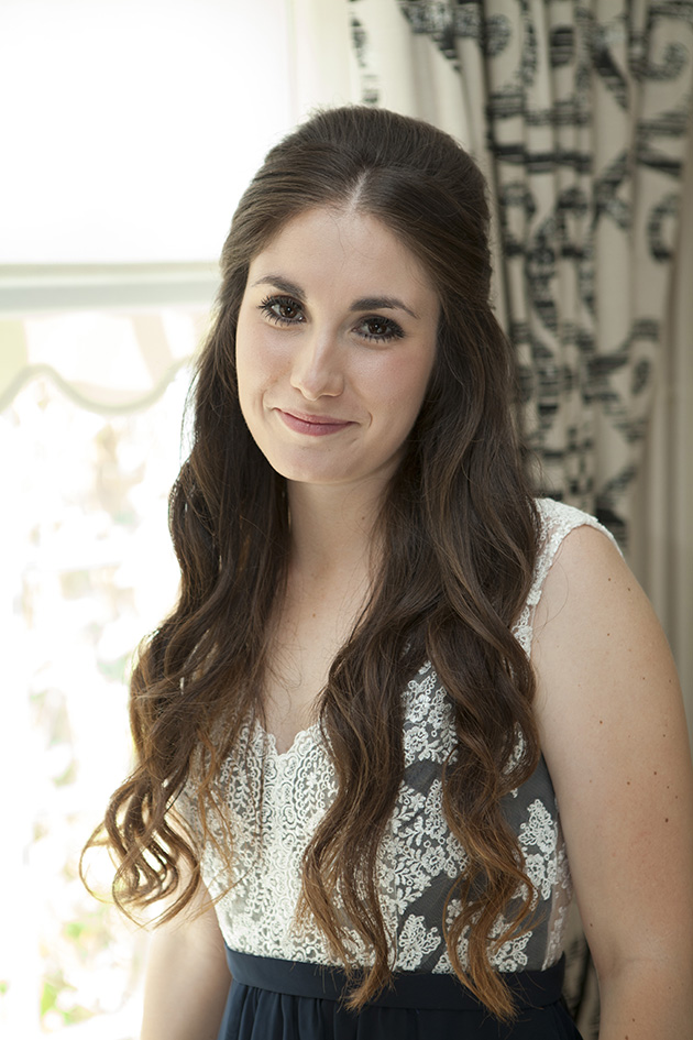 Portrait of bridesmaid by a window