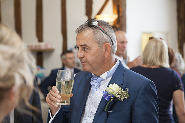 Groom having a beer in the bar at Little Channels