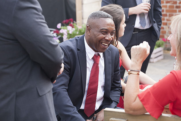 Wedding guests laughing