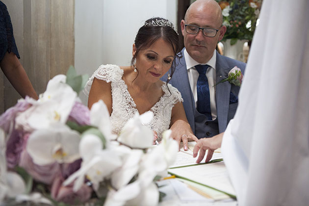 Bride signing register