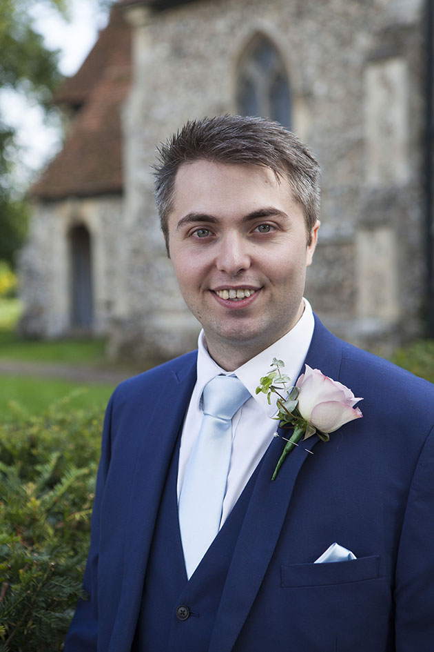 Portrait of young man outside church