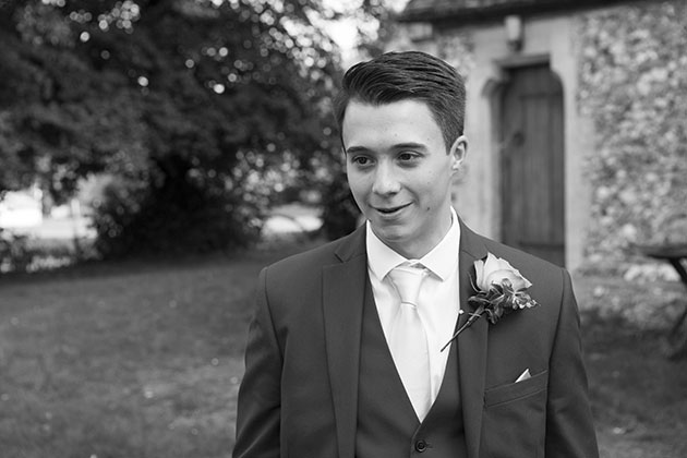 Natural portrait of young man in smart wedding suit