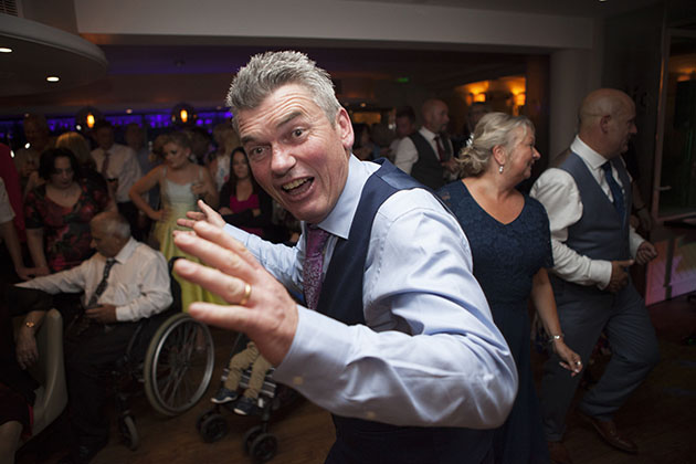 Man dancing at wedding reception