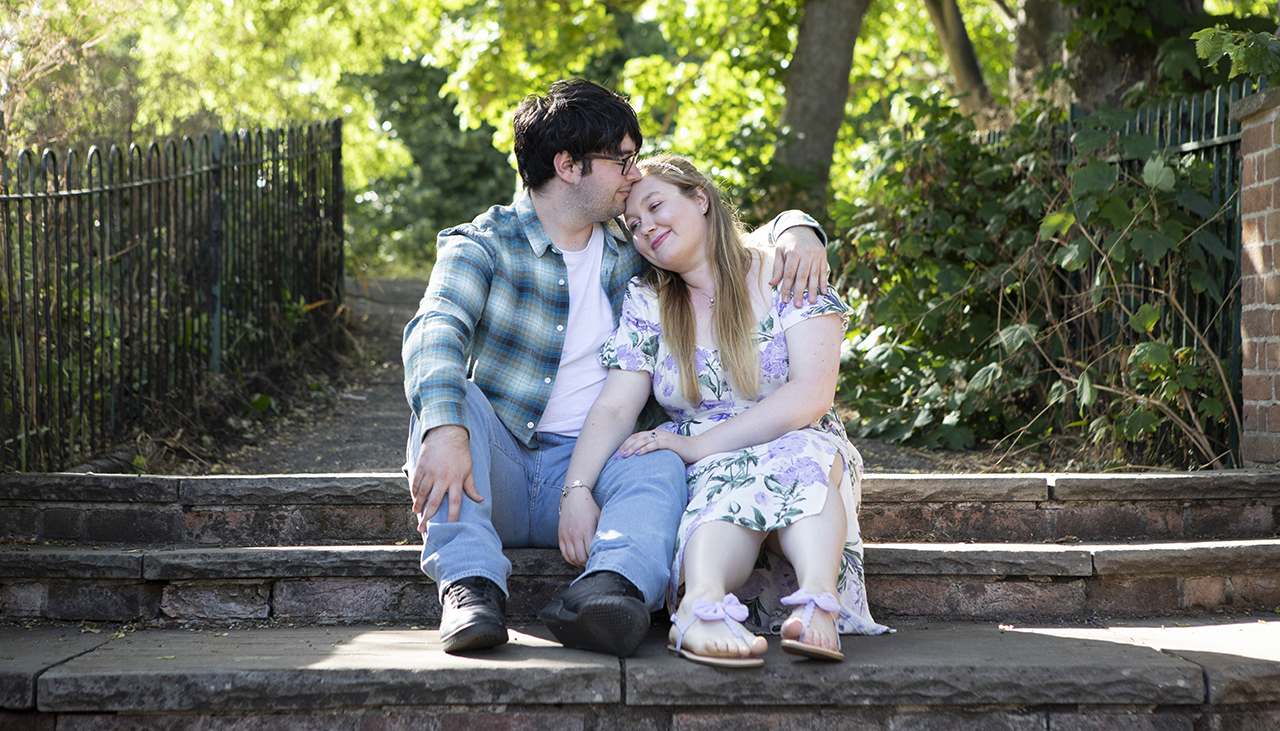 Young couple sitting in an Essex park